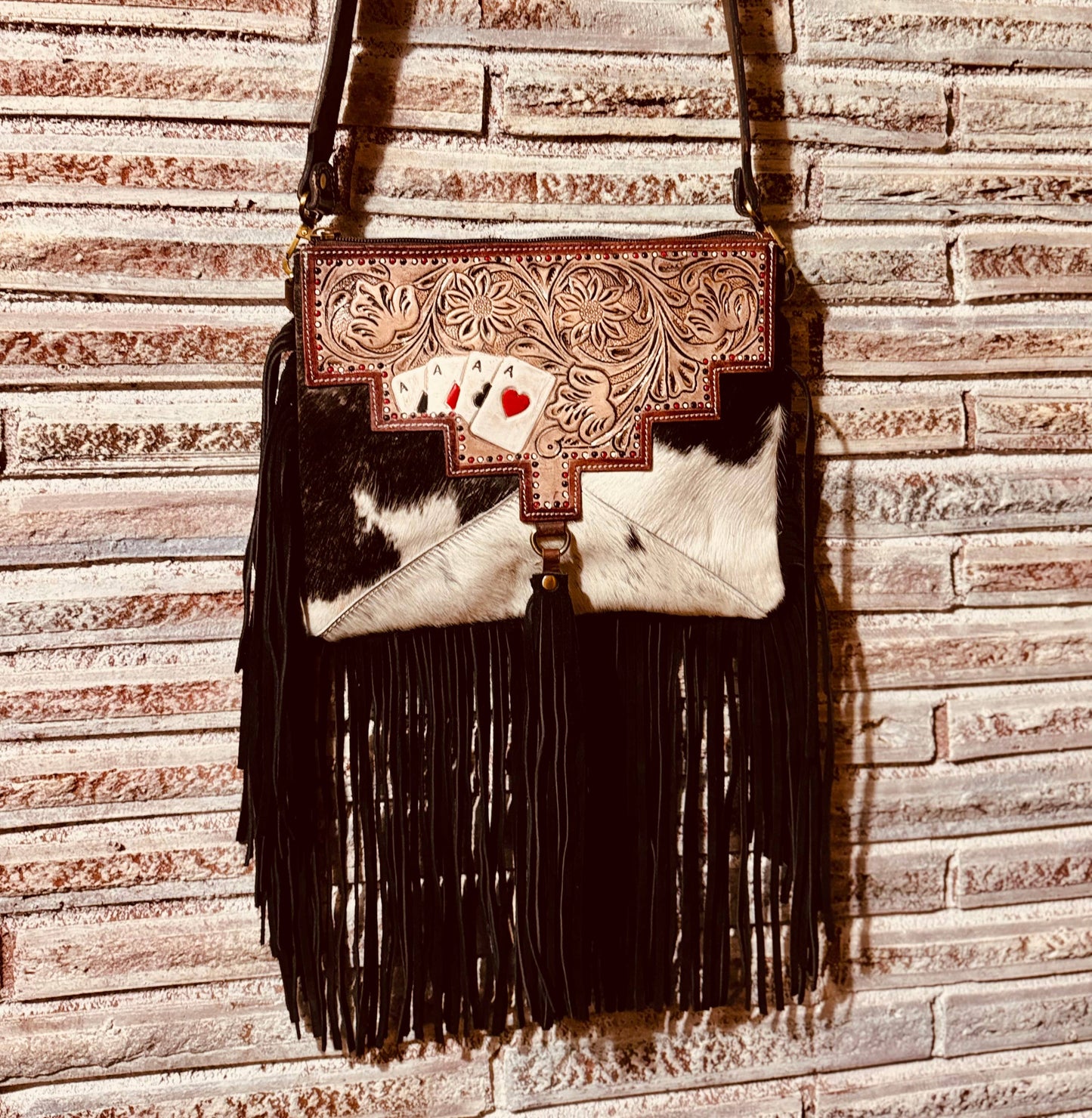 Ace's cowhide tooled crossbody bag.