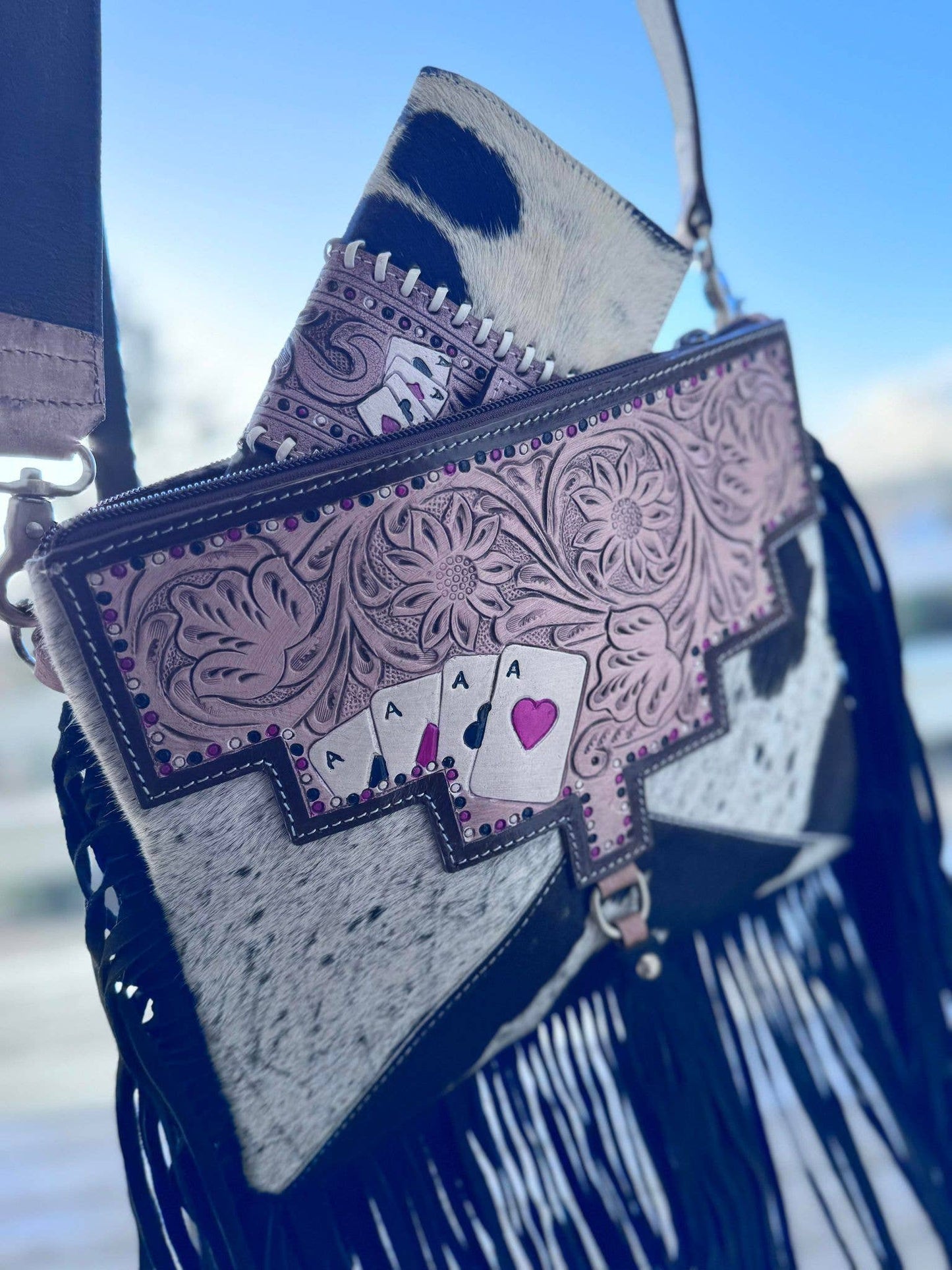 Ace's cowhide tooled crossbody bag.