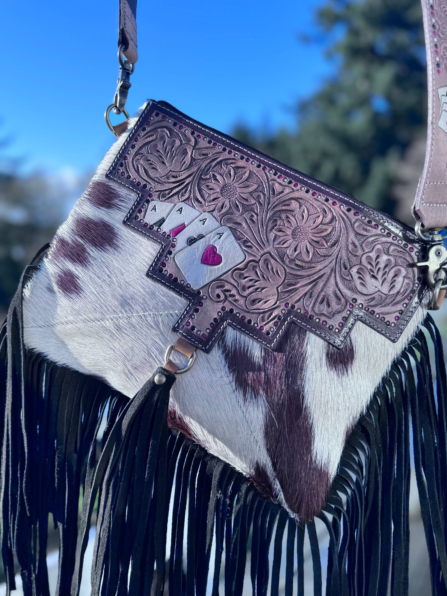 Ace's cowhide tooled crossbody bag.