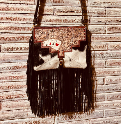 Ace's cowhide tooled crossbody bag.