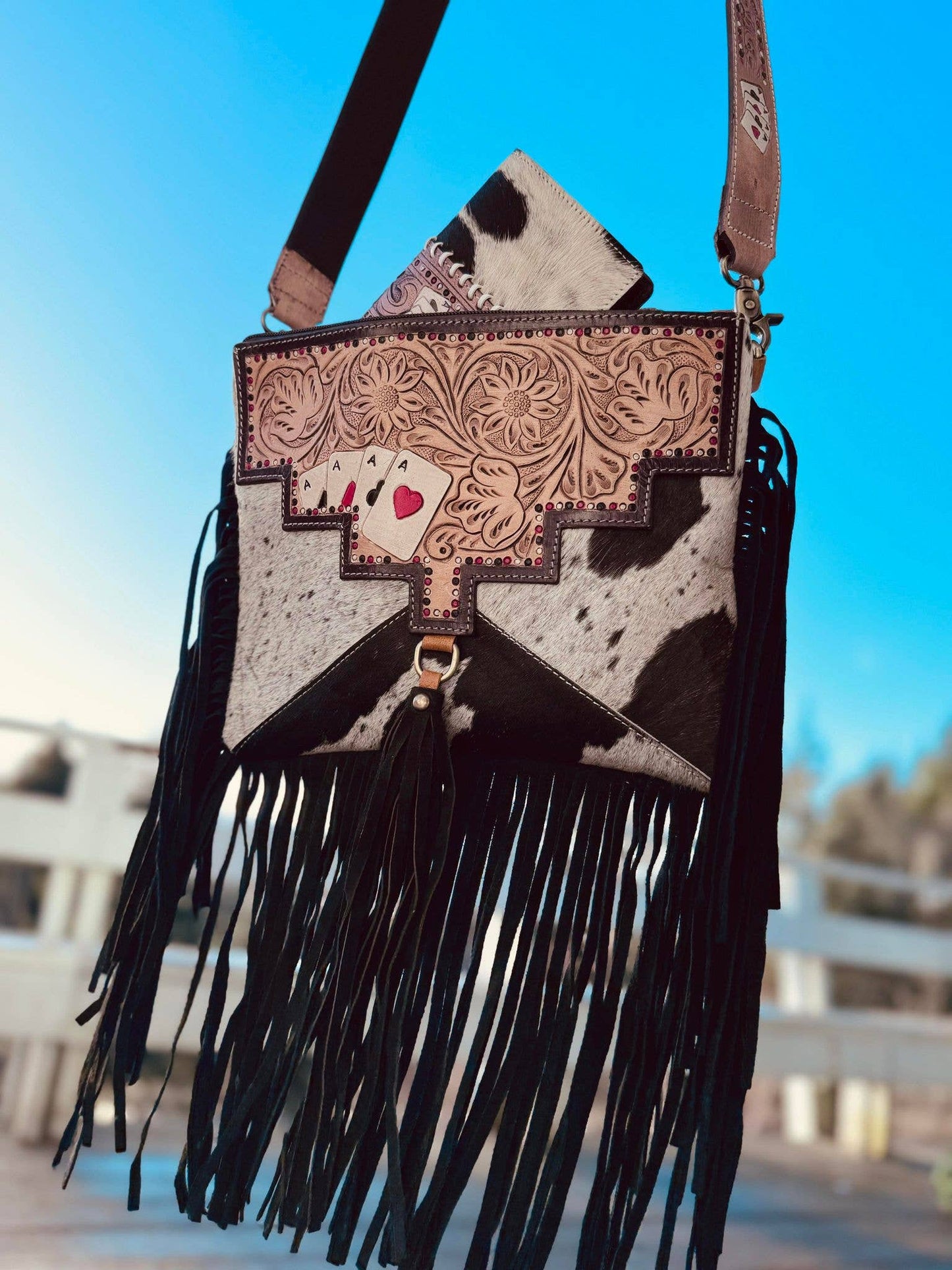Ace's cowhide tooled crossbody bag.